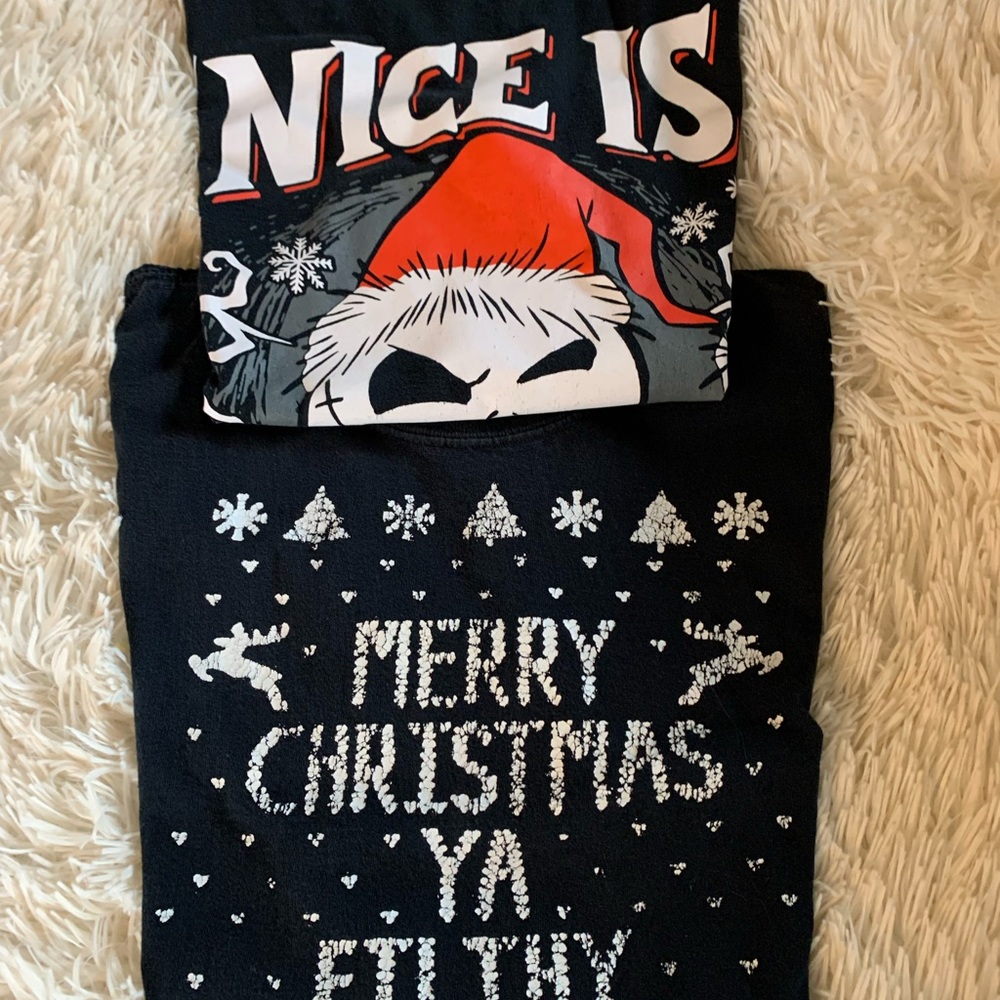 Lot of 2 Junior Medium Black Christmas Graphic T-Shirt in good used condition.